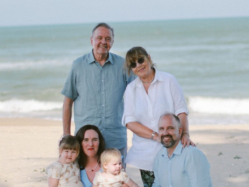 Happy multigenerational family together on the beach