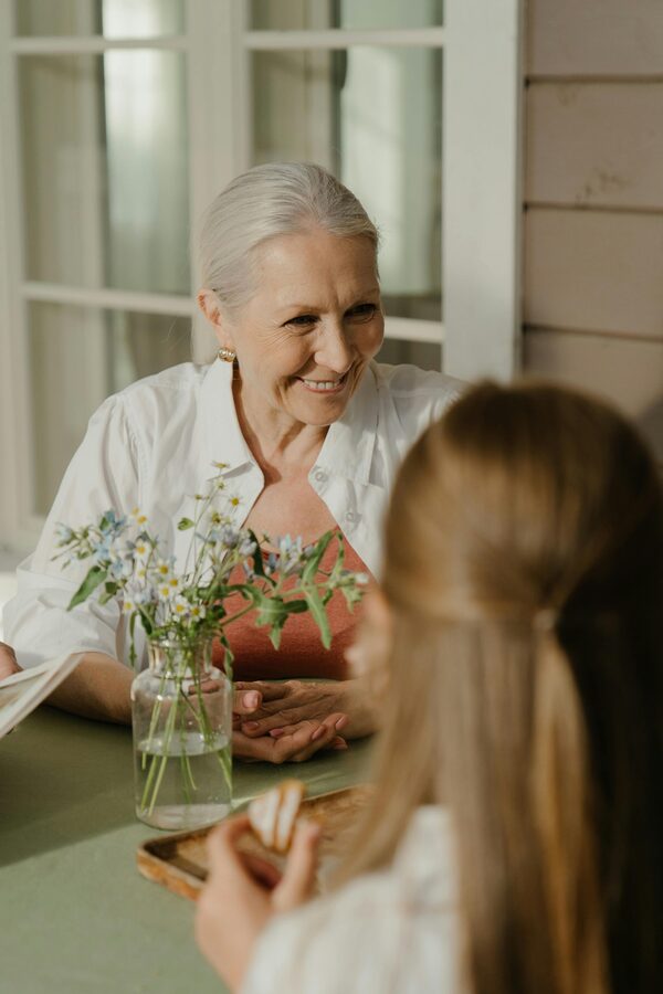 Elderly couple smiling and waving